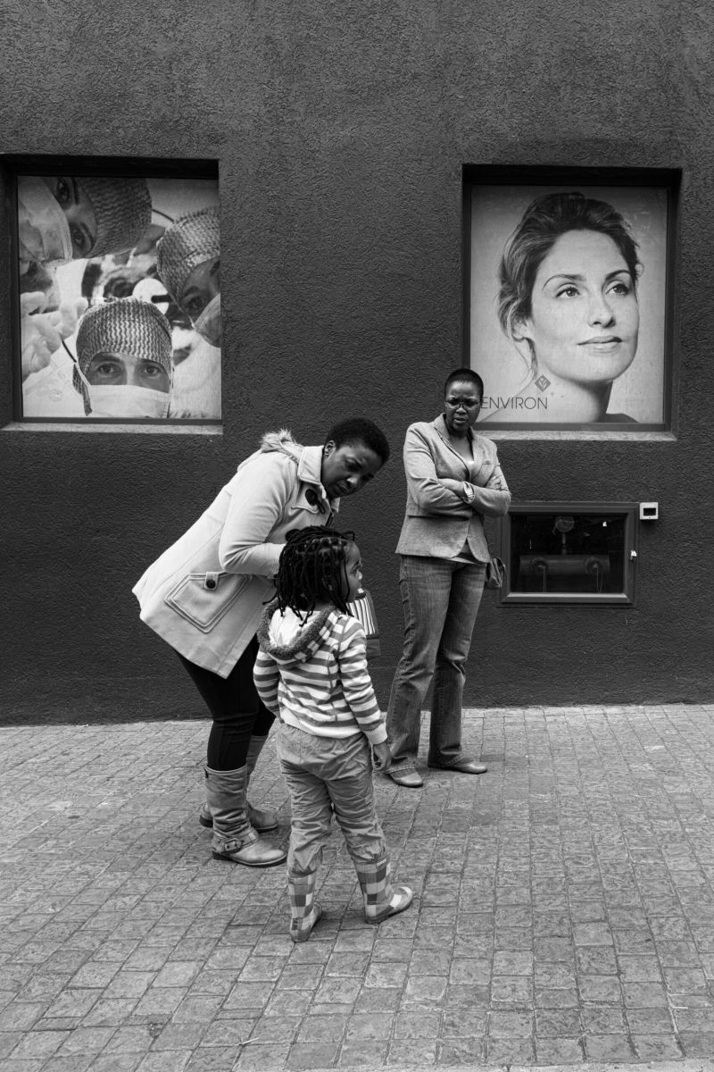 Posters watch a family scene