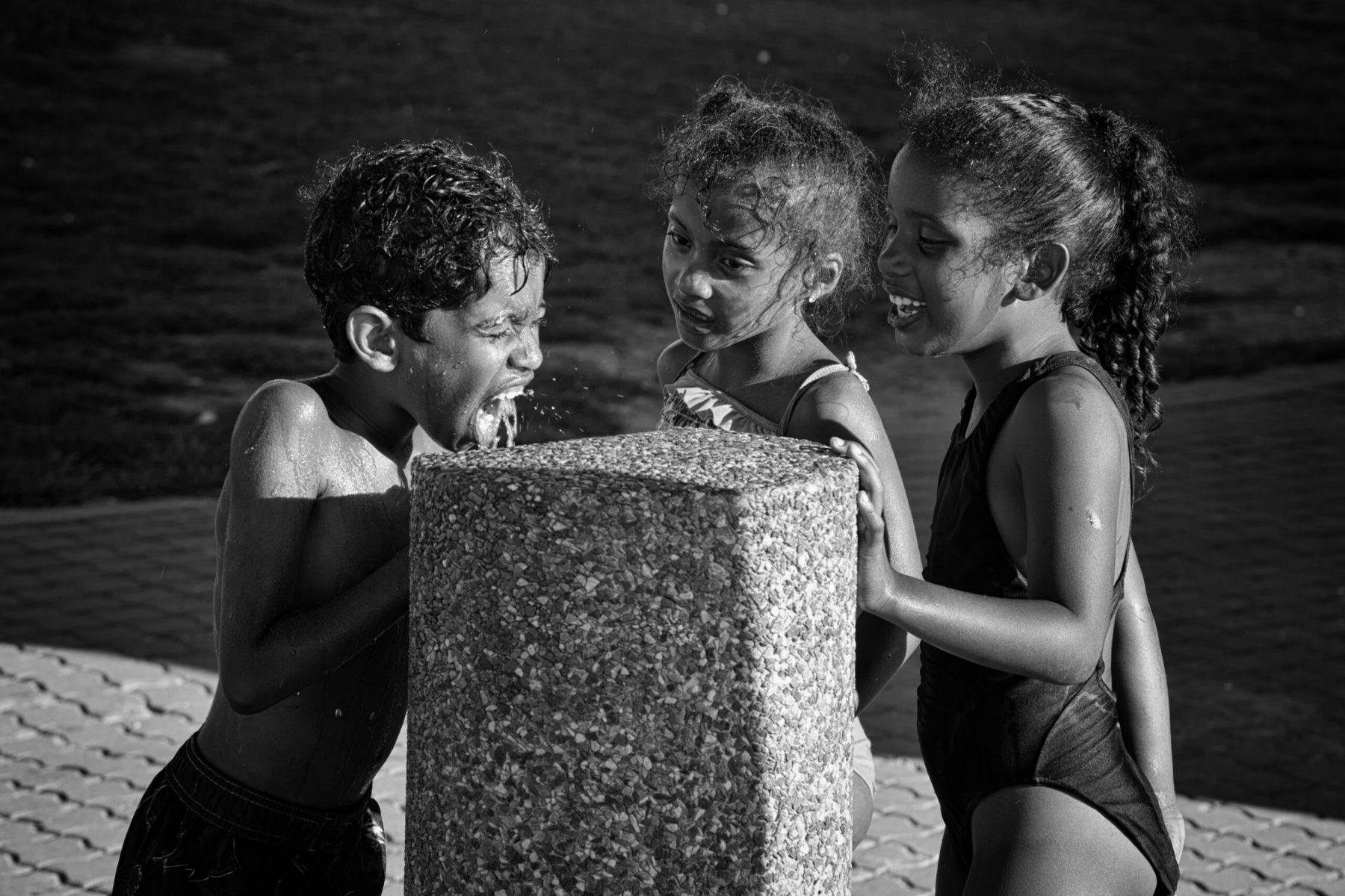 Children at the water fountain on the Sea Point promenade